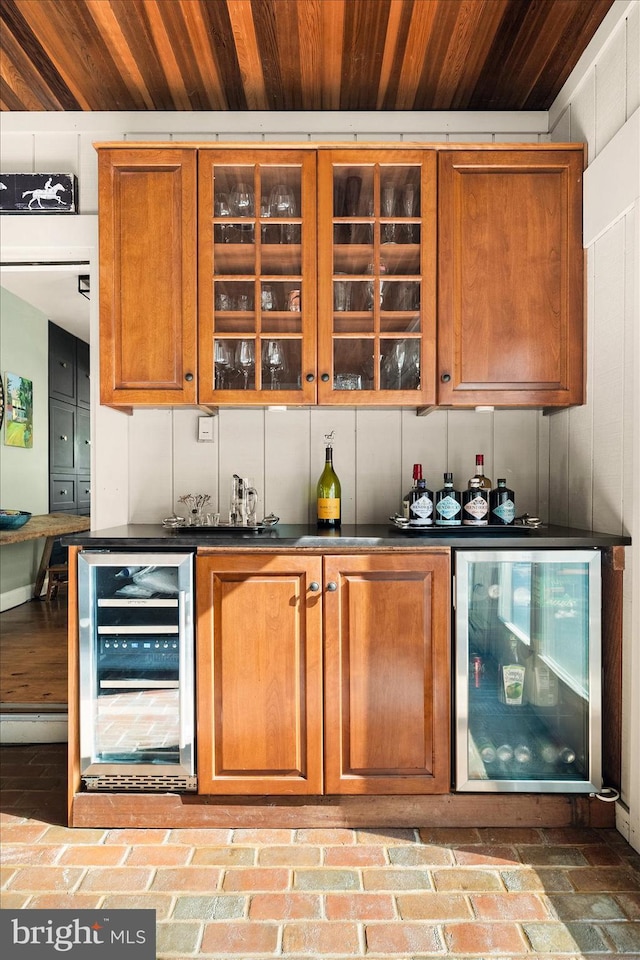 bar with beverage cooler and wood ceiling