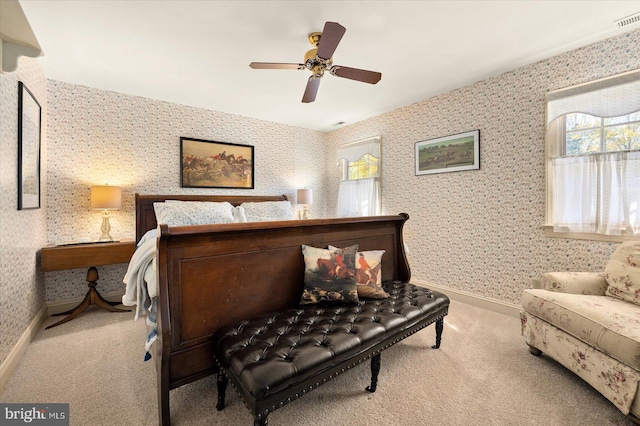 bedroom with light carpet and ceiling fan