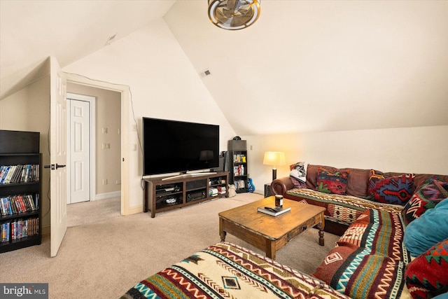 carpeted living room with lofted ceiling