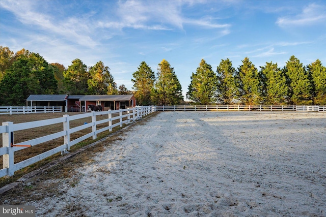 view of yard with a rural view