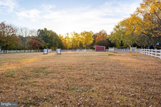 view of yard with a rural view