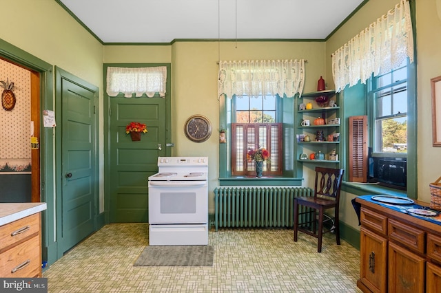 kitchen with radiator heating unit, ornamental molding, and white range with electric cooktop