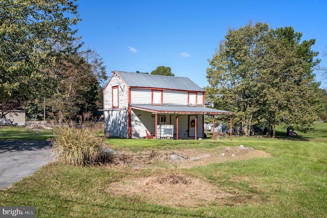 view of front of house featuring a front yard and a porch