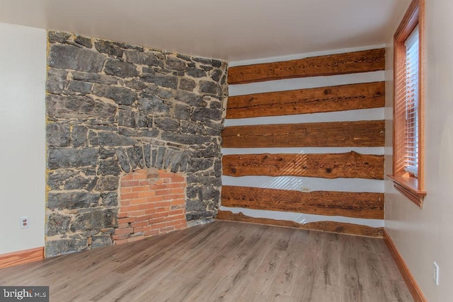 staircase featuring beam ceiling and hardwood / wood-style flooring