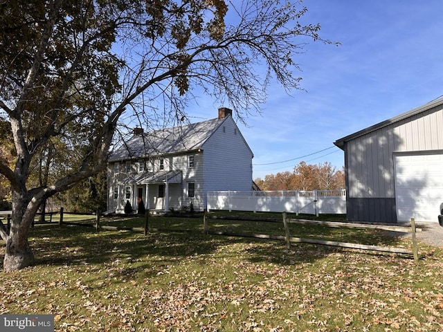 view of yard with an outbuilding and a garage