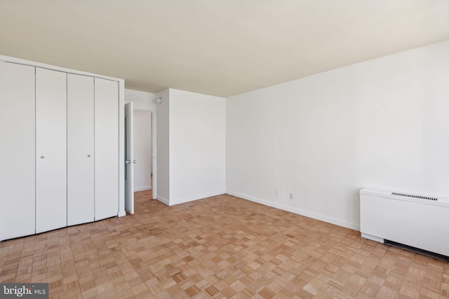 unfurnished bedroom with light parquet floors