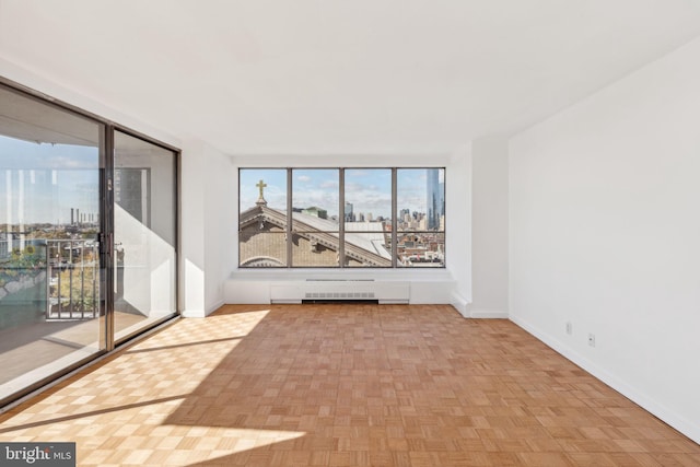 spare room with light parquet floors