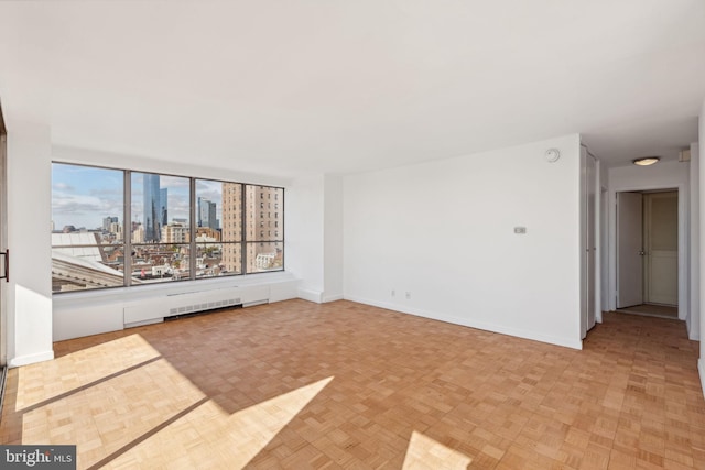 unfurnished living room with light parquet floors