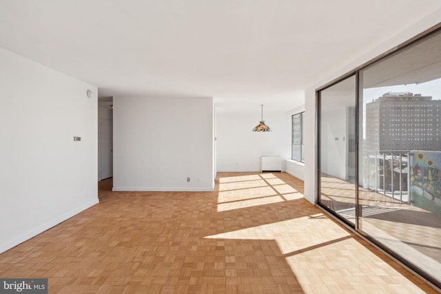 unfurnished room featuring light parquet floors