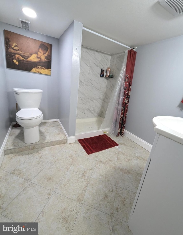 bathroom featuring walk in shower, vanity, and toilet