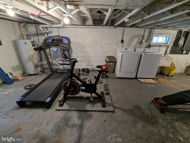 basement with water heater and washer and clothes dryer