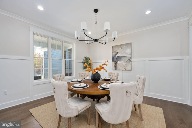 dining space with dark hardwood / wood-style flooring and crown molding