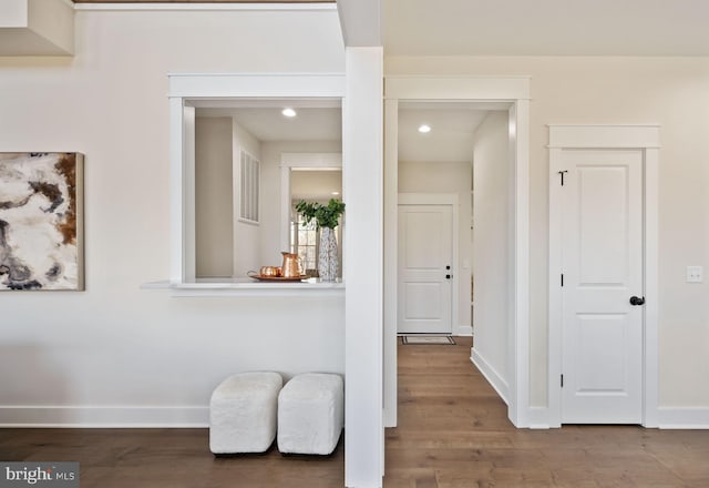 corridor featuring hardwood / wood-style floors