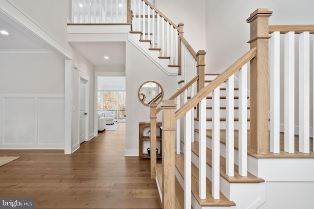 interior space with dark hardwood / wood-style flooring and crown molding