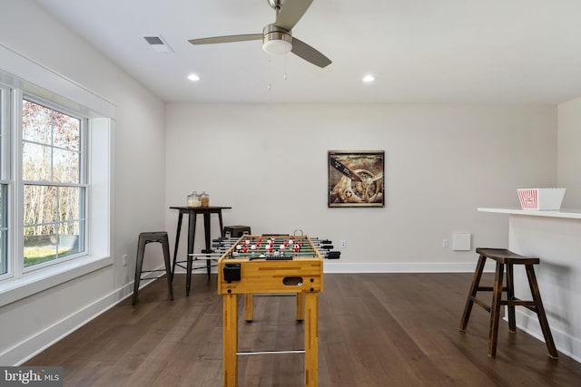 rec room featuring dark hardwood / wood-style flooring and ceiling fan