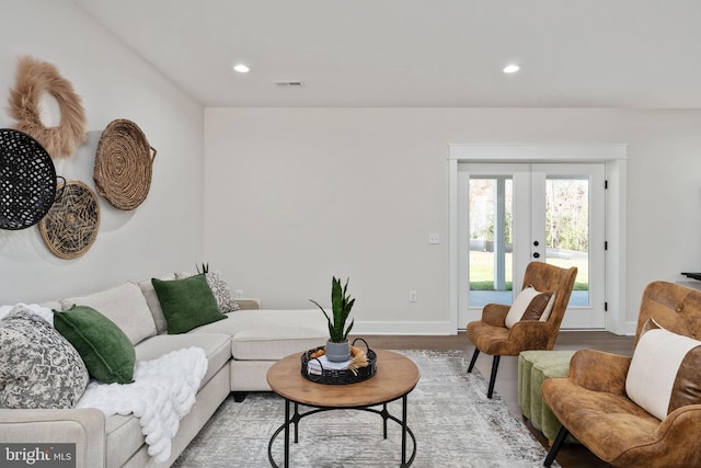 living room featuring french doors and hardwood / wood-style floors