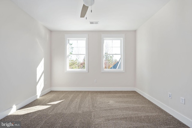 unfurnished room featuring carpet flooring and ceiling fan