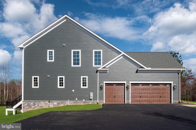 view of property exterior featuring a garage