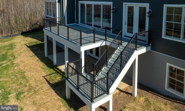 wooden terrace featuring a yard