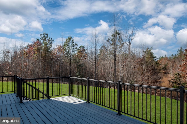 wooden terrace with a yard