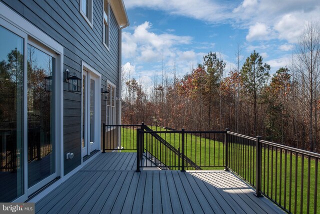 deck featuring a lawn