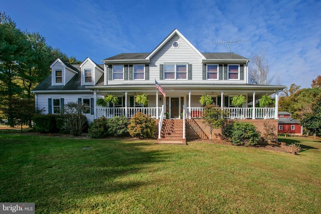 view of front facade featuring covered porch and a front yard