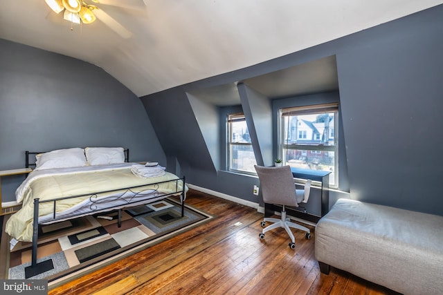 bedroom featuring ceiling fan, lofted ceiling, and dark hardwood / wood-style flooring