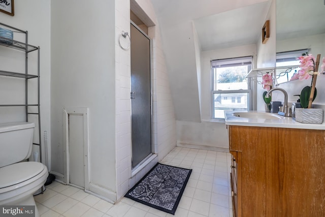 bathroom with toilet, walk in shower, and vanity