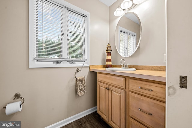 bathroom featuring vanity and hardwood / wood-style floors