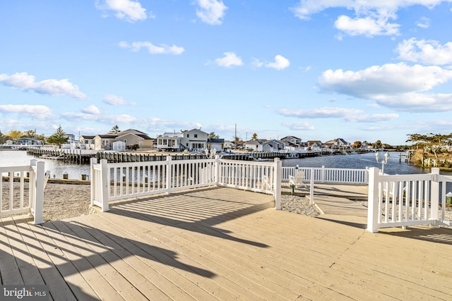 wooden deck featuring a water view