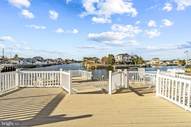 dock area featuring a deck with water view