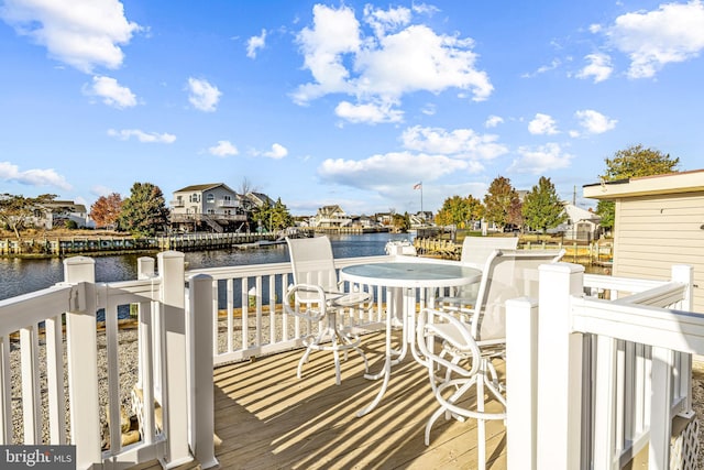 wooden deck with a water view