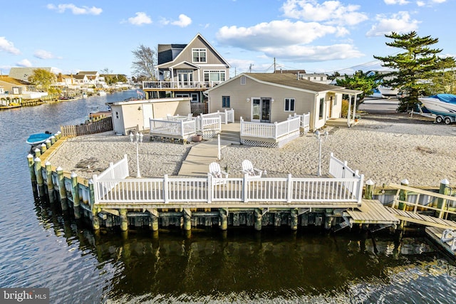 view of dock with a deck with water view