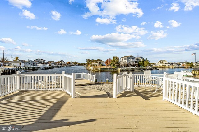 dock area with a deck with water view