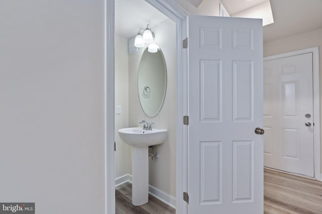 bathroom featuring sink and hardwood / wood-style floors