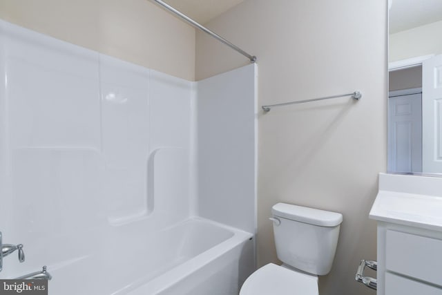 full bathroom featuring  shower combination, vanity, and toilet