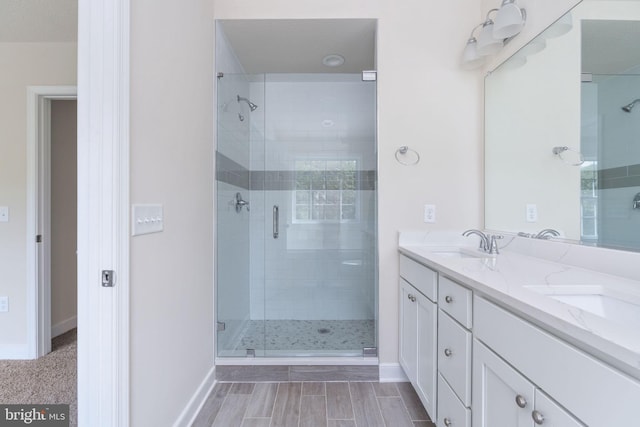 bathroom featuring vanity and an enclosed shower