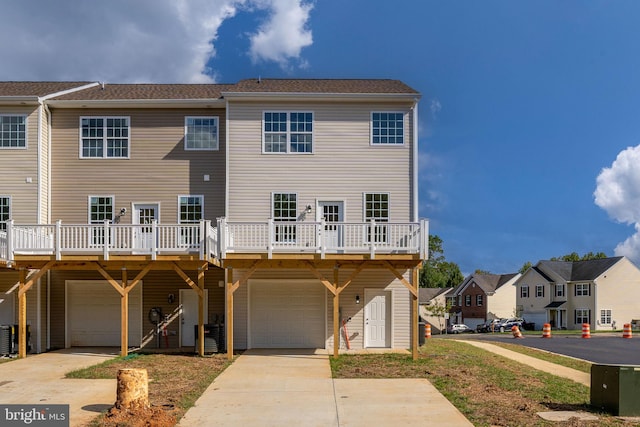 back of house with a garage