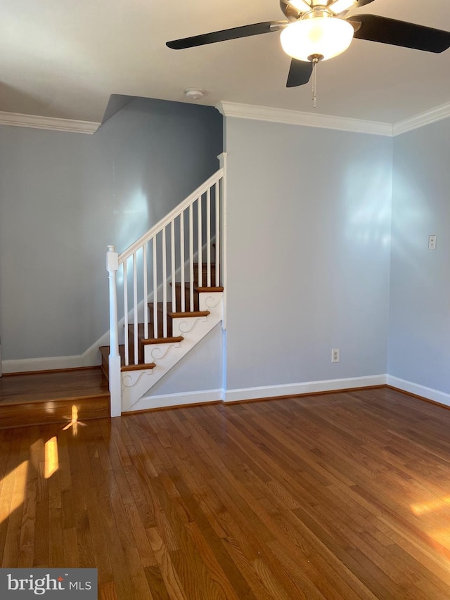 interior space featuring crown molding, wood-type flooring, and ceiling fan