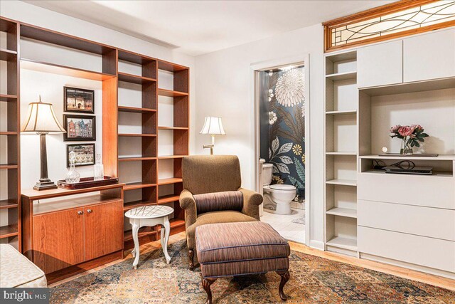 sitting room featuring hardwood / wood-style floors