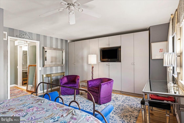 bedroom featuring light hardwood / wood-style floors and ceiling fan