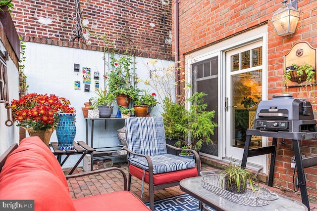 balcony featuring a patio and grilling area