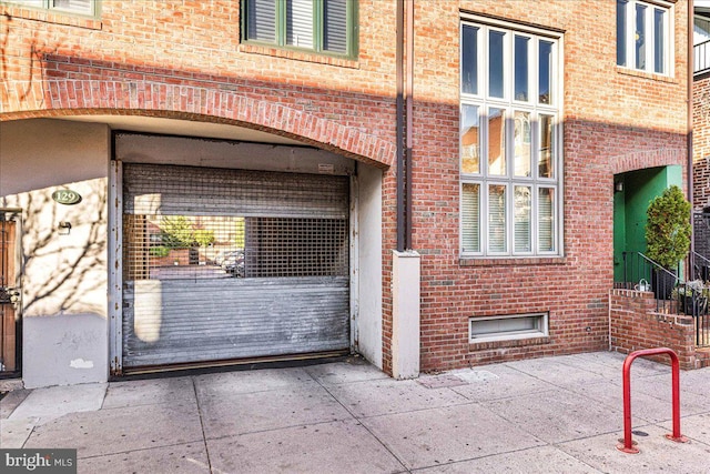 view of exterior entry featuring a patio area