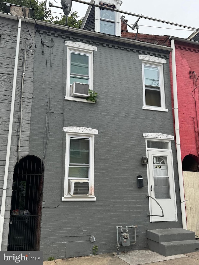 view of front of property featuring cooling unit