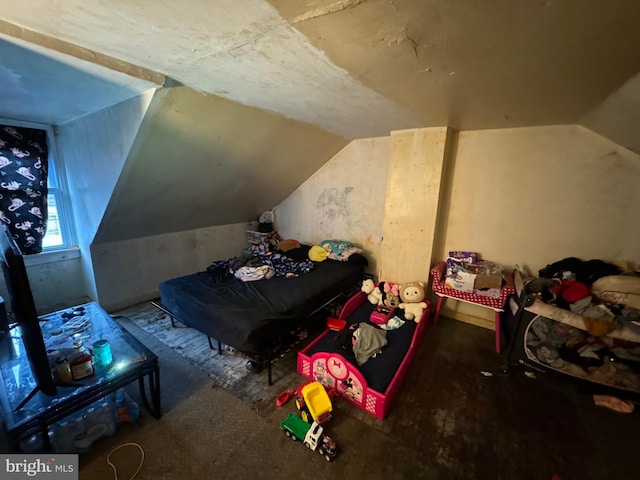 bedroom with lofted ceiling