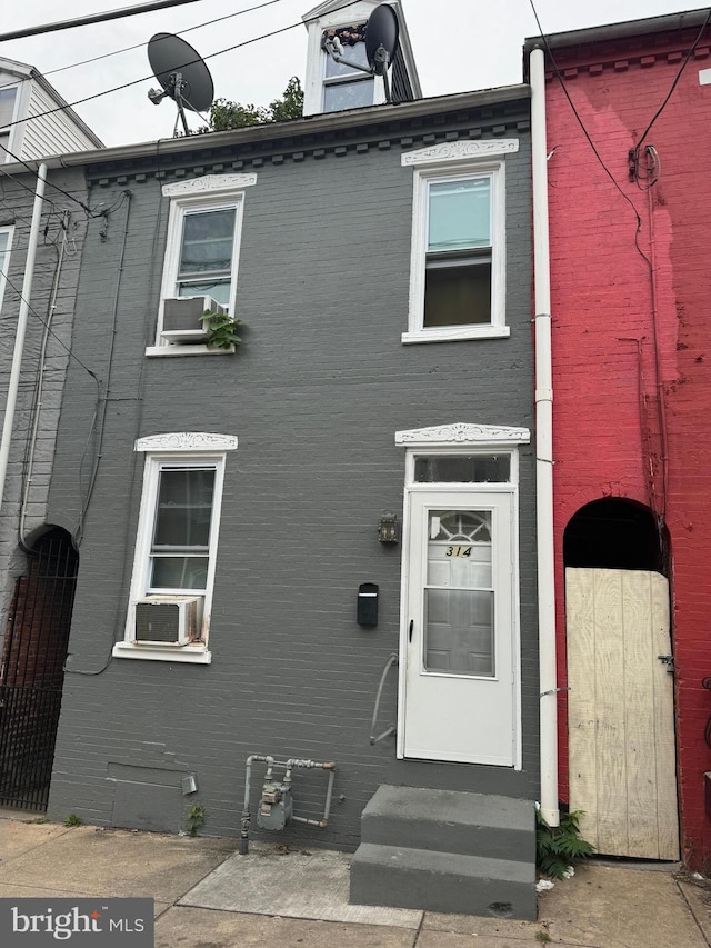 view of front of home featuring cooling unit