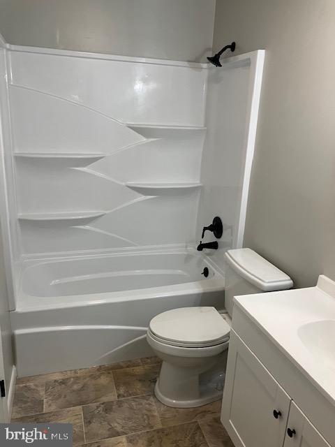 full bathroom with toilet, bathtub / shower combination, and vanity