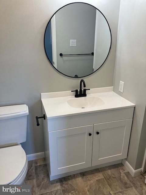 bathroom with vanity and toilet