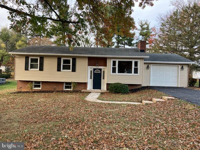 split foyer home featuring a garage