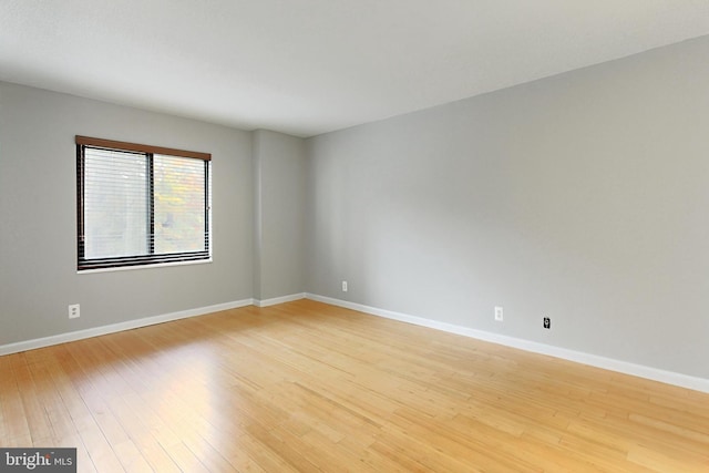 spare room featuring light hardwood / wood-style flooring